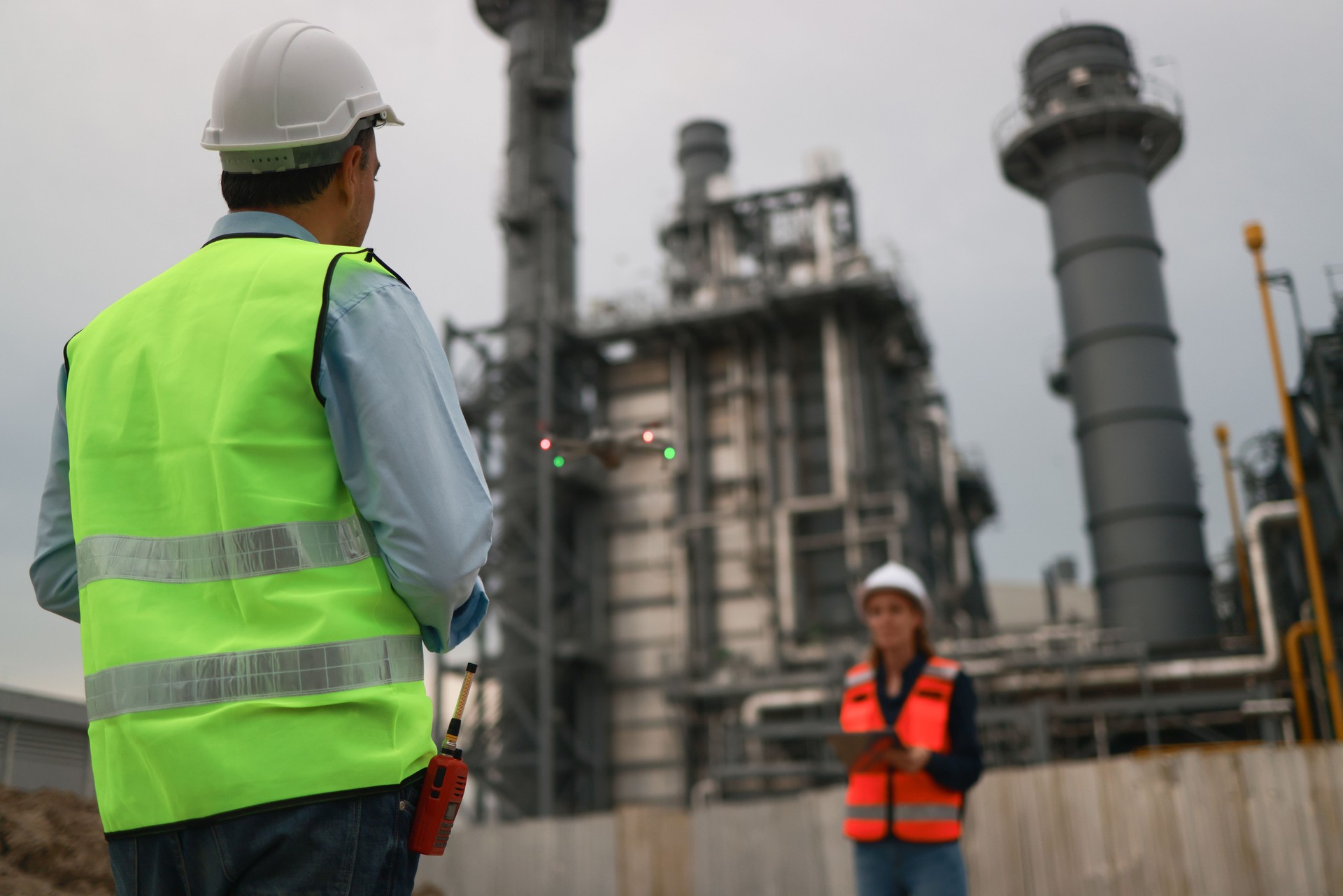 The thermal power plant engineers team utilizes technology for the inspection and surveying of a thermal power plant. Surveyors and exploration teams deploy high survey instruments to observe the power plant and assess its security measures.